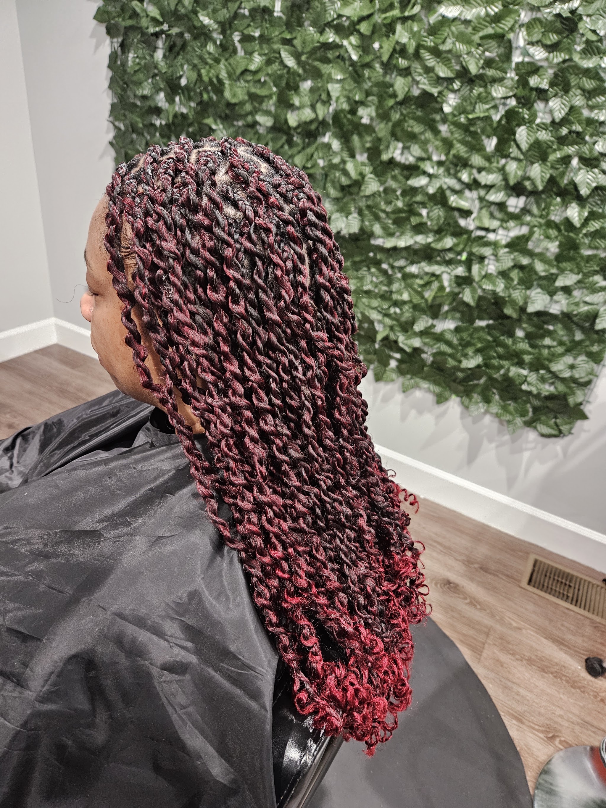 Burgundy curly-end braids from behind